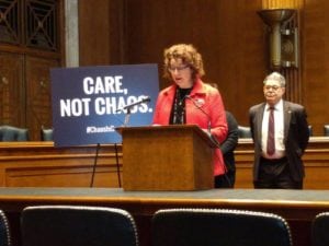 Amy Shir speaks at a Washington press conference in defense of the Affordable Care Act as U.S. Sen. Al Frankin looks on (photo provided) 